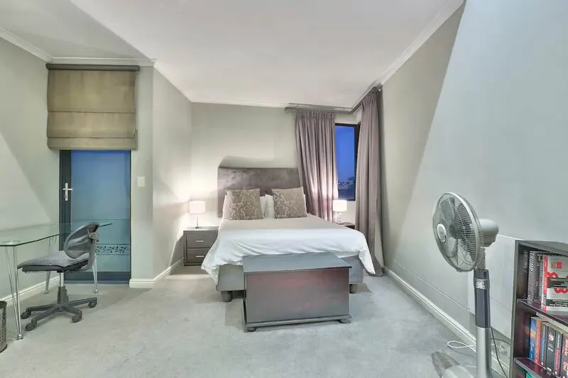 double bed bedroom with desk to study