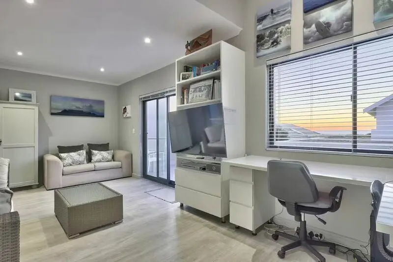 twin bed bedroom with built-in cupboards and desk to study
