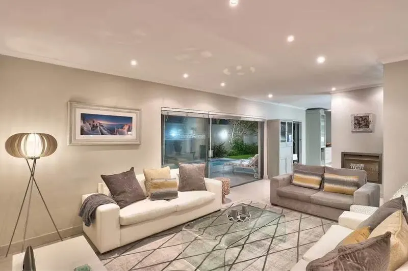 luxury main bedroom in cape town villa with queen sized bed and en-suite bathroom with modern interior